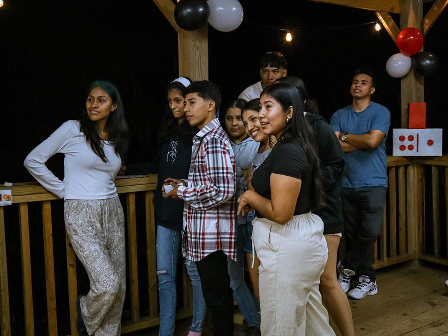 Young adults at a Youth Fusion night on the deck