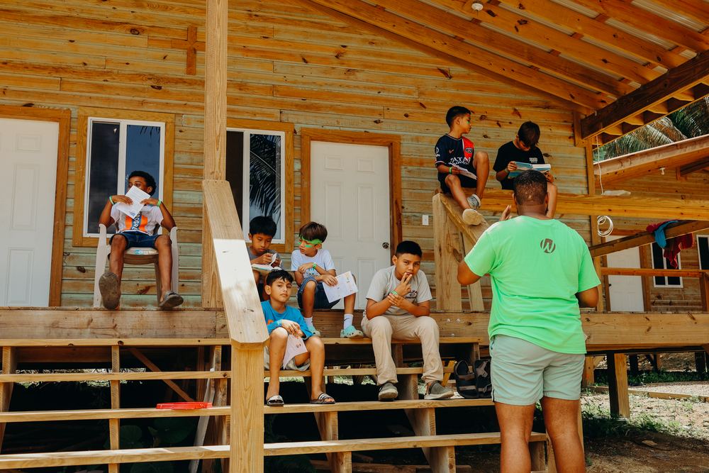 Wooden cabin with a front porch at The Peak