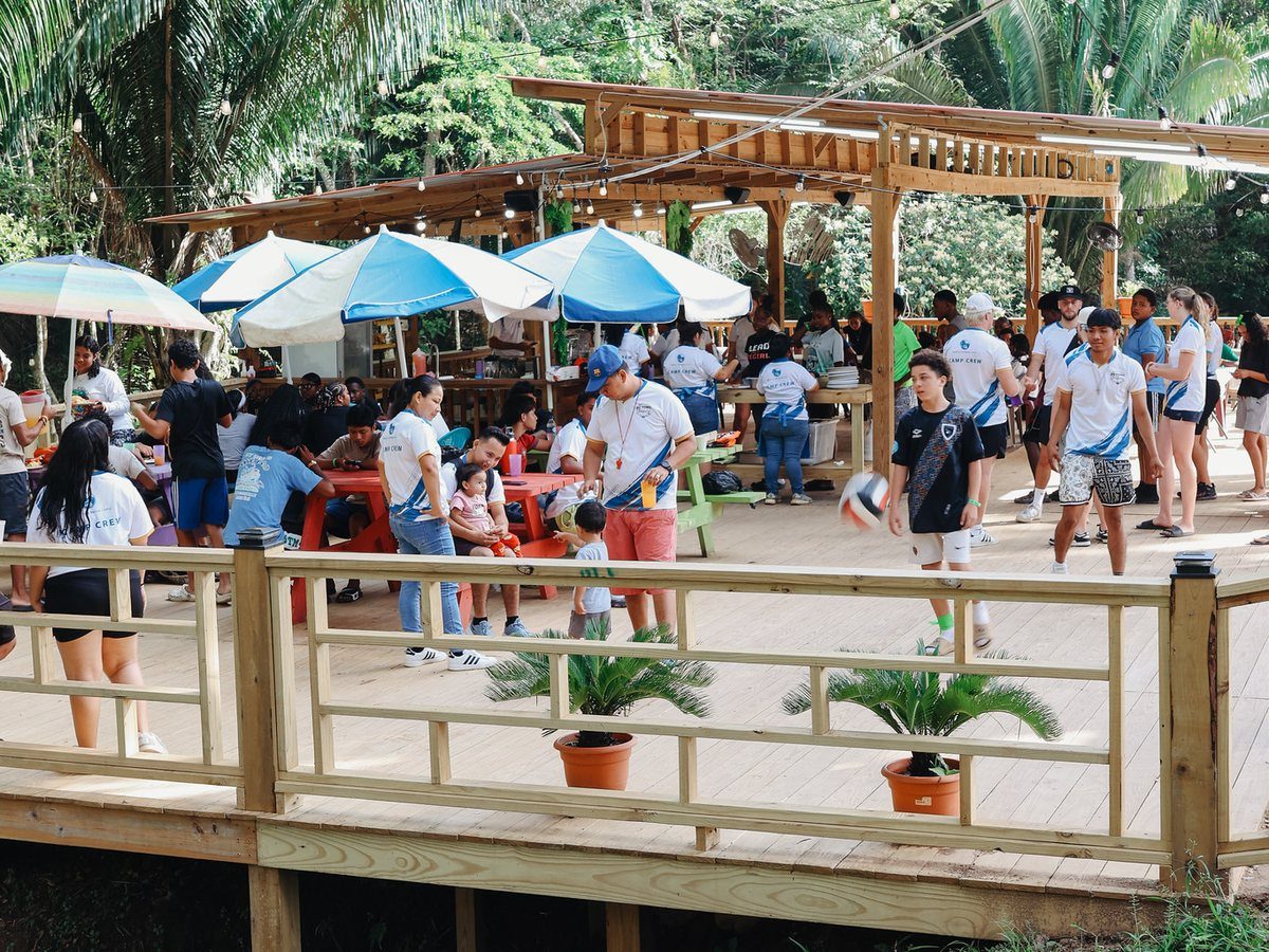 Umbrellas and picnic tables on the wooden deck by the Snack Shack