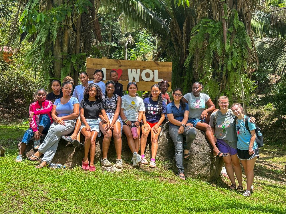 Campers gathered at the 'I love WOL' sign
