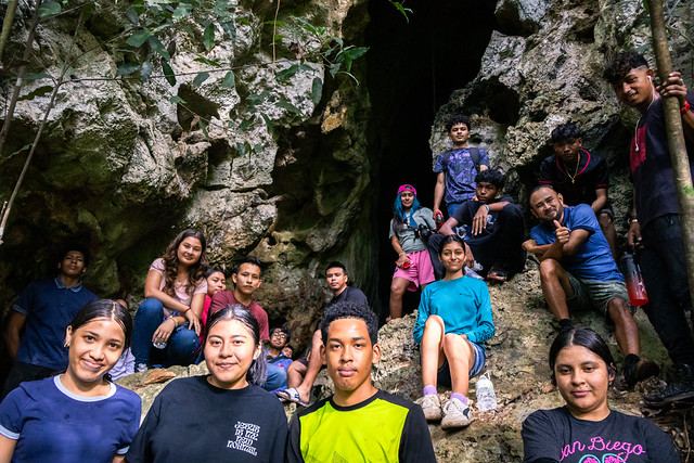 Young adults exploring a cave